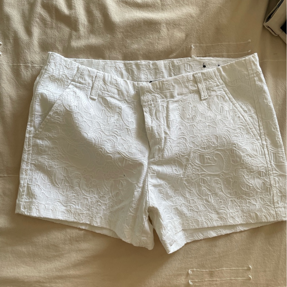 White shorts with embossed detailing